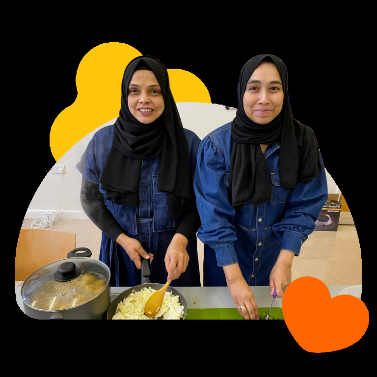 Local cooking class instructors prepping food for their budget cooking class at Feldy community space