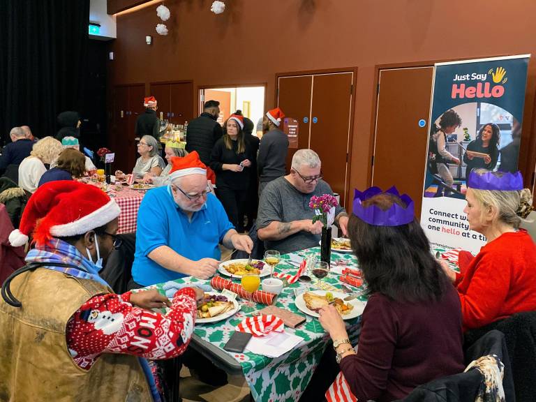 Locals tucking in to Christmas Dinner at the Harca Elders Christmas Party