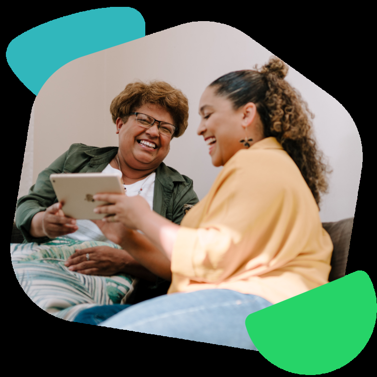 Two women looking at an iPad screen