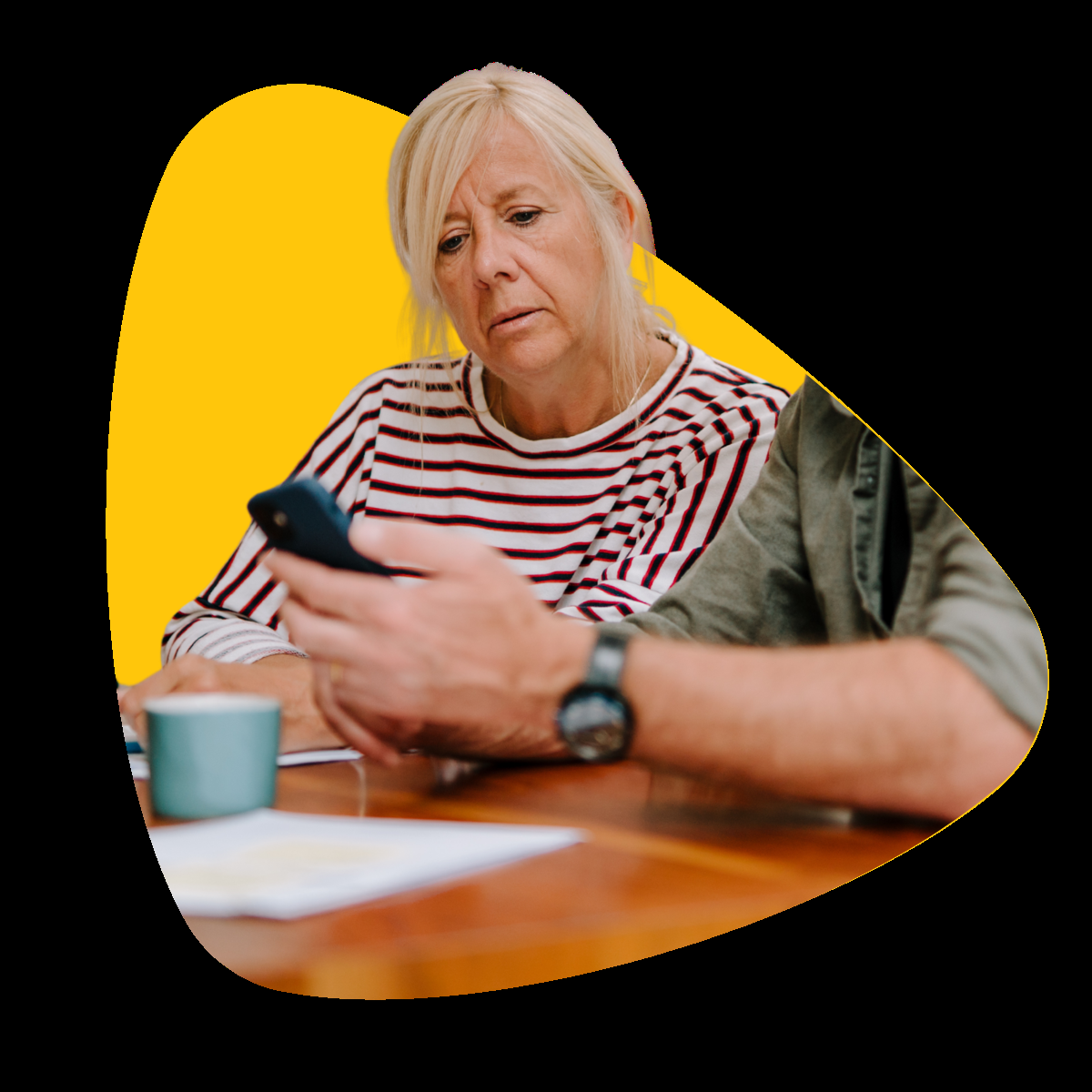 Image of a woman being guided on using apps on her phone